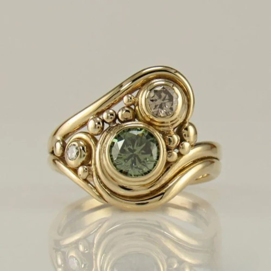 Emerald Gemstone Ring with Yellow Gold Detail - Vossary