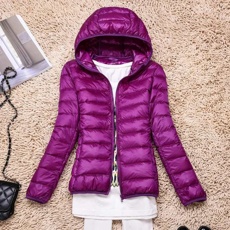 Compact Women's Insulated Travel Coat - Waterproof Hooded Jacket