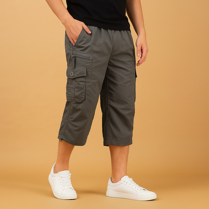 Men’s long cargo shorts with breathable cotton fabric and multiple pockets, ideal for summer, travel, and outdoor activities.