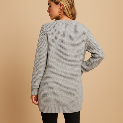 Long v-neck cardigan for women with relaxed fit, soft breathable knit, and practical pockets. Perfect for layering in casual or office outfits.