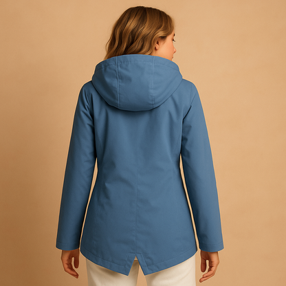 Women’s long waterproof raincoat with hood and breathable design, suitable for rainy days, commuting, and everyday outdoor wear.